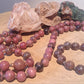 Mala da meditazione in Rodonite, Pietra Guru Agata e rame