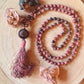 Mala da meditazione in Rodonite, Pietra Guru Agata e rame