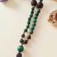 Mala da meditazione artigianale in Pietra Lavica e Malachite con Olio Essenziale – 108 perle