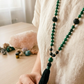 Mala da meditazione artigianale in Pietra Lavica e Malachite con Olio Essenziale – 108 perle