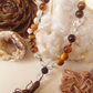 Bracciale Mala in Cristallo di Rocca, Occhio di Tigre e Pietra Lavica – 27 pietre naturali