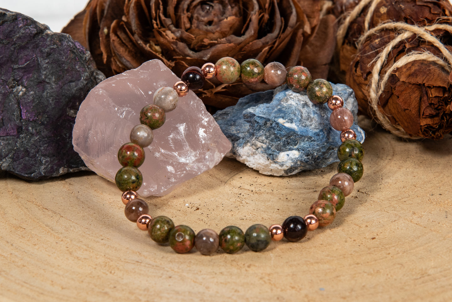 Bracciale perle 6 mm pietra di luna nera, occhio di bue, unakite, rame