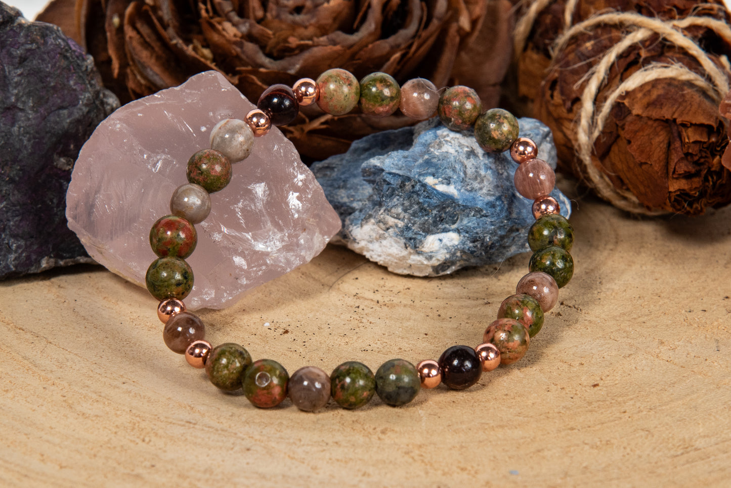 Bracciale perle 6 mm pietra di luna nera, occhio di bue, unakite, rame