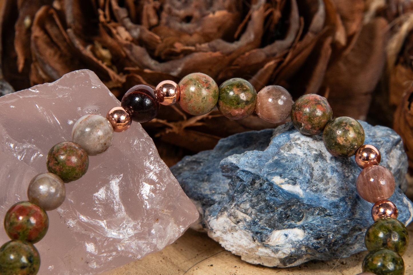 Bracciale perle 6 mm pietra di luna nera, occhio di bue, unakite, rame