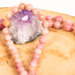 Mala da meditazione in Rodonite, Pietra Guru Quarzo rosa e Rame
