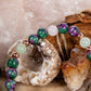 Bracciale perle 6 mm zoisite, quarzo rosa, giadeite, rame