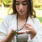 Mala da meditazione artigianale in Pietra Lavica e Malachite con Olio Essenziale – 108 perle