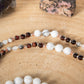 Mala con 108 perle di Howlite, Agata bianca, Diaspro zebrato, Occhio di bue, Perla Guru rame