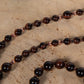 Mala con 108 perle di Occhio di bue, Perla Guru Rame