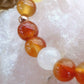 Bracciale perle 8mm calcite gialla, corniola, agata bianca, rame