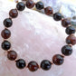 Bracciale perle 8mm occhio di bue, onice, rame