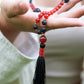 la madregea mala in pietra lavica, agata rossa e rame per meditare fatta a mano 108 perle